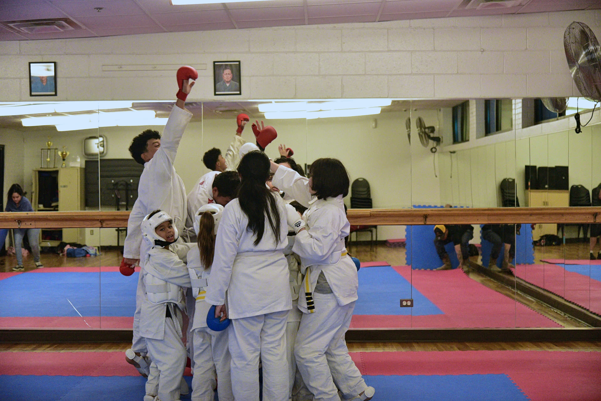 Dojo students gathering with their instructor